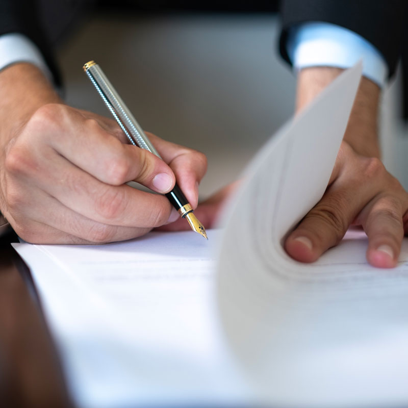 lawyer signing papers