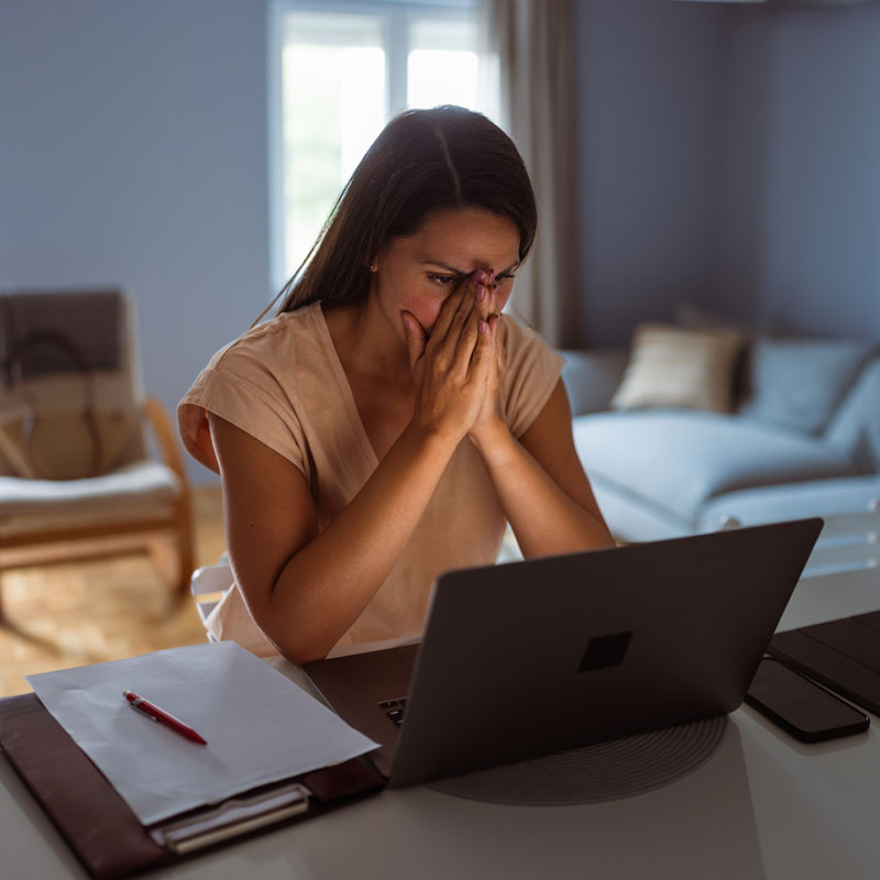 lady in front of laptop upset