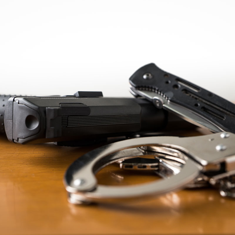 handcuffs and weapons